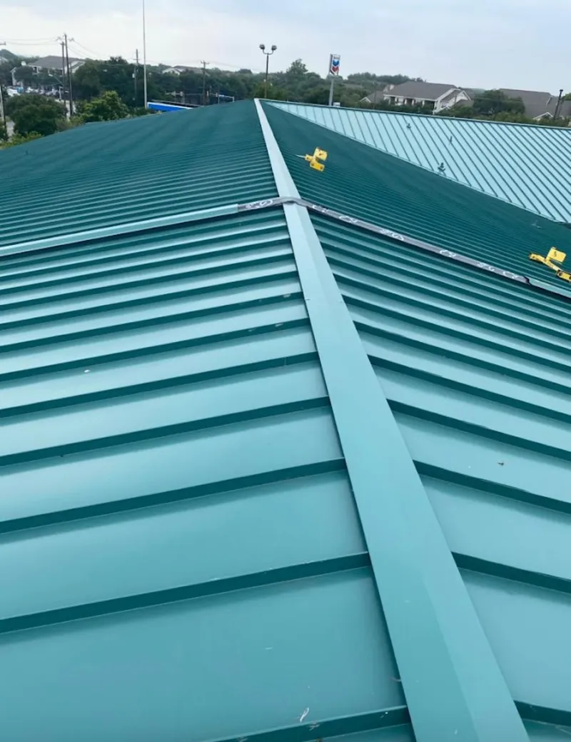 Green commercial metal roof ridge and valley for Metal Roof Repair in Prior Lake