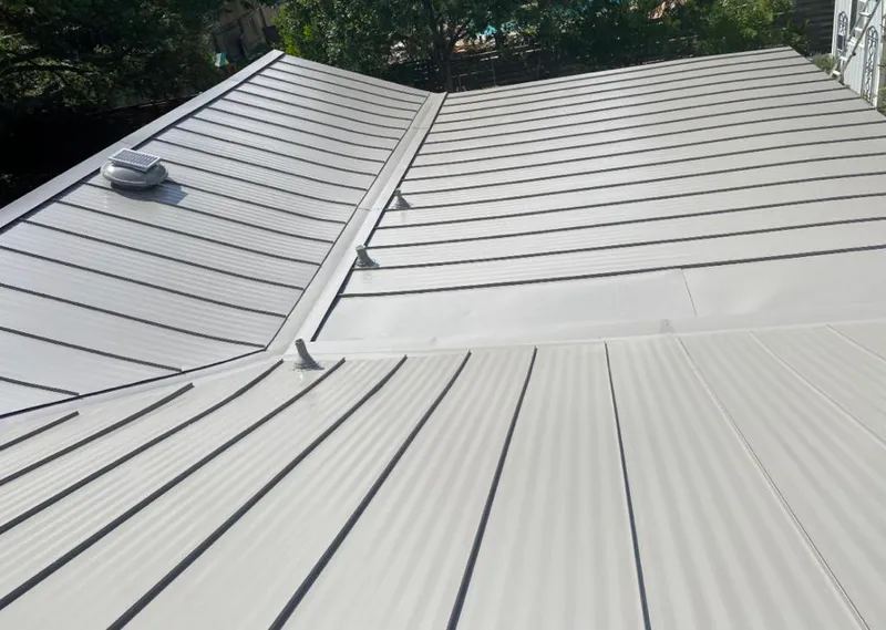 Solar attic fan installed on a metal roof for Roof Ventilation in Prior Lake