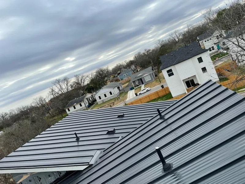 Standing seam metal roof panels with vents for Skylight Repair in Prior Lake